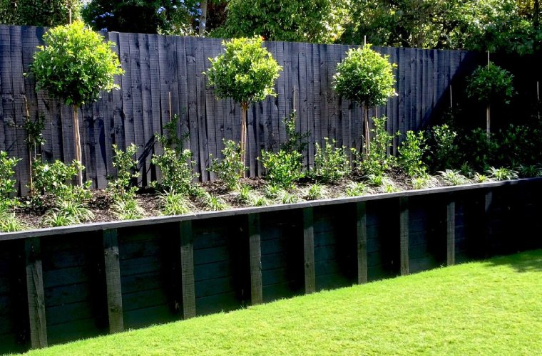 landscaping-services-nz-with-trees-garden-retaining wall