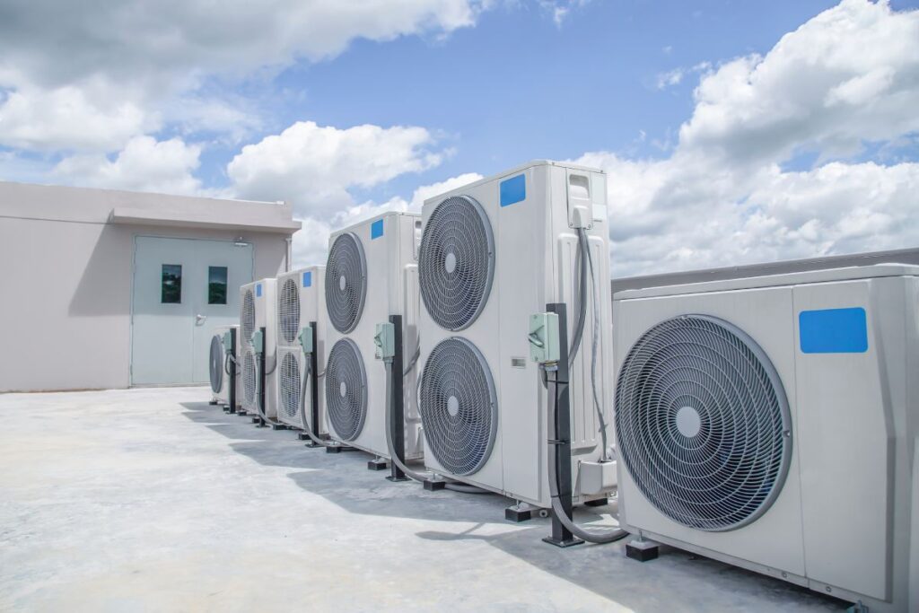 Commercial heat pump installation systems arranged on a building rooftop in Auckland New Zealand.