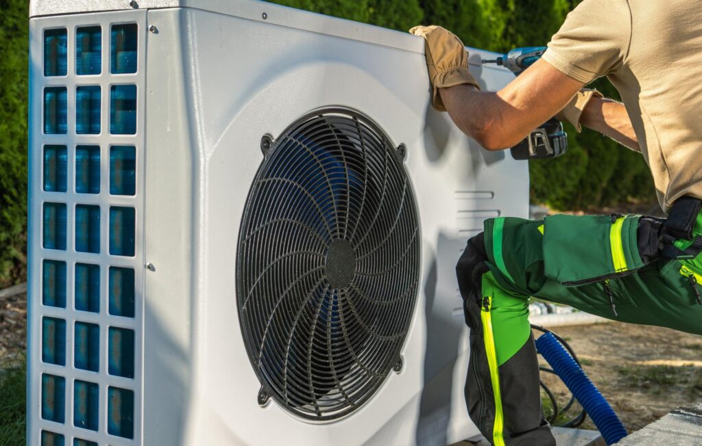 Technician performing hassle free and affordable heat pump installation in New Zealand.