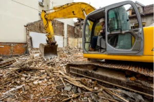 Excavator performing demolition work at a construction site in NZ