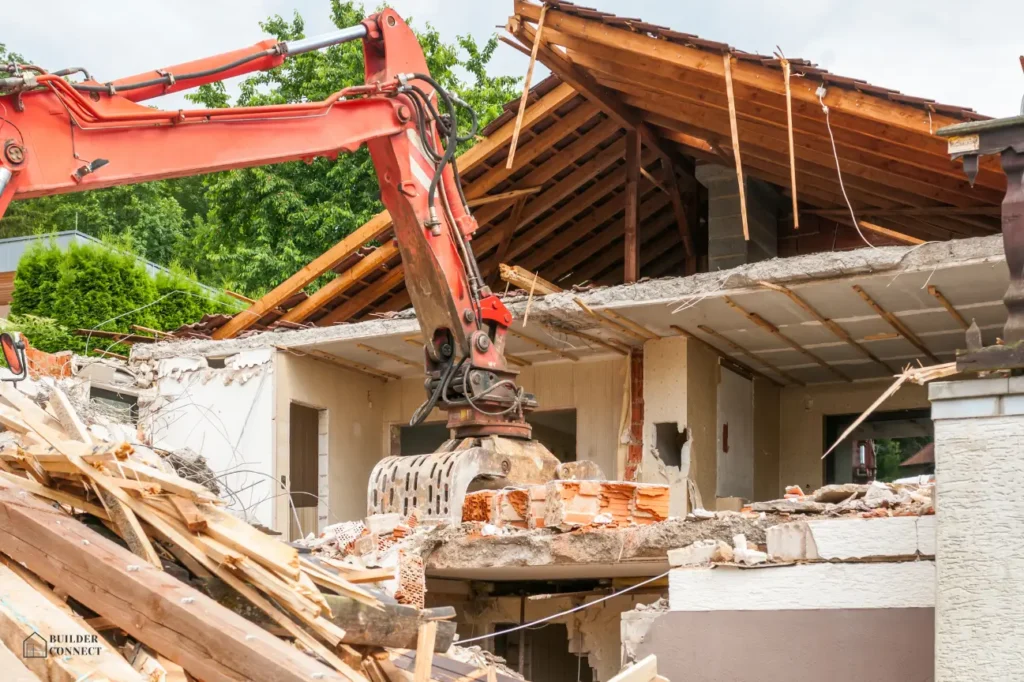 Excavator tearing down a wooden and brick house during residential demolition in NZ