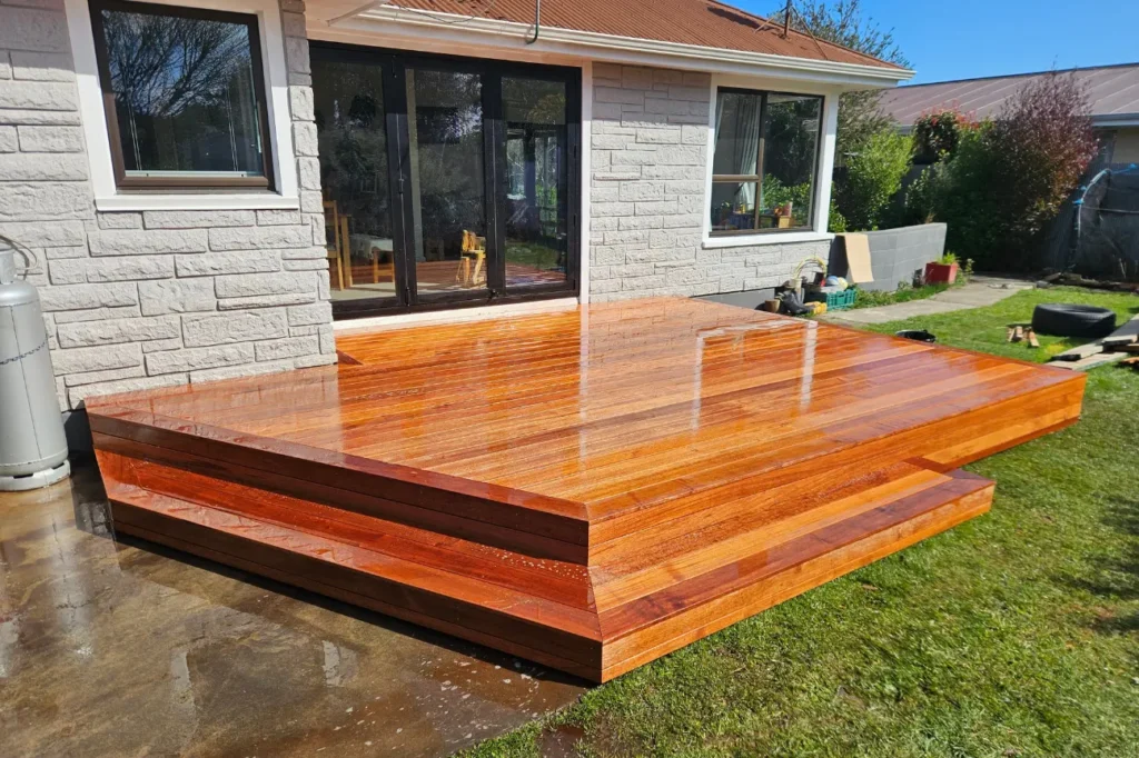 Polished timber deck with step access built by deck builders christchurch.