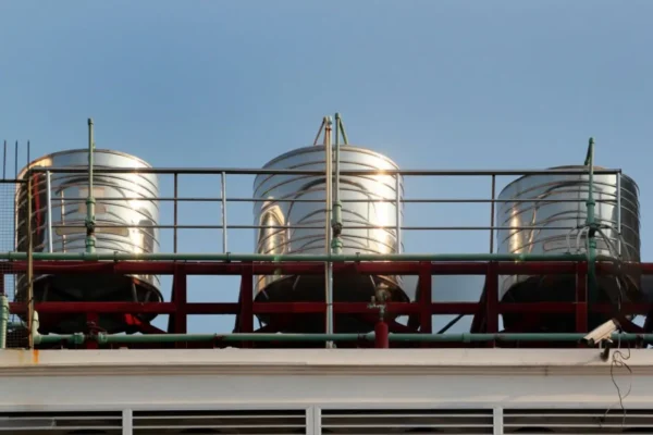 Three stainless steel rooftop tanks showing Water Tank Installation in New Zealand NZ.